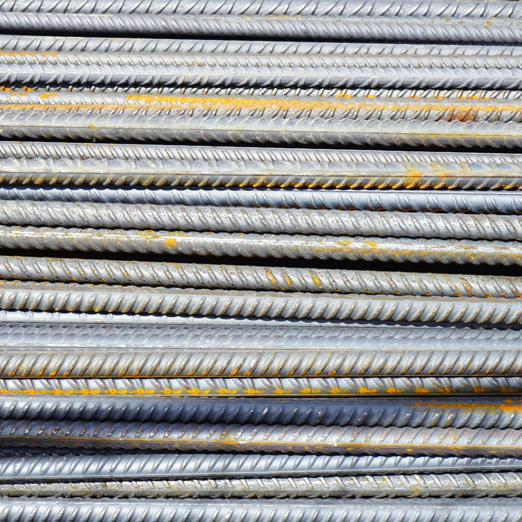 iron rods reinforcing bars rods steel bars 46167 46167 Close-up of stacked rusty steel reinforcing bars used in construction.