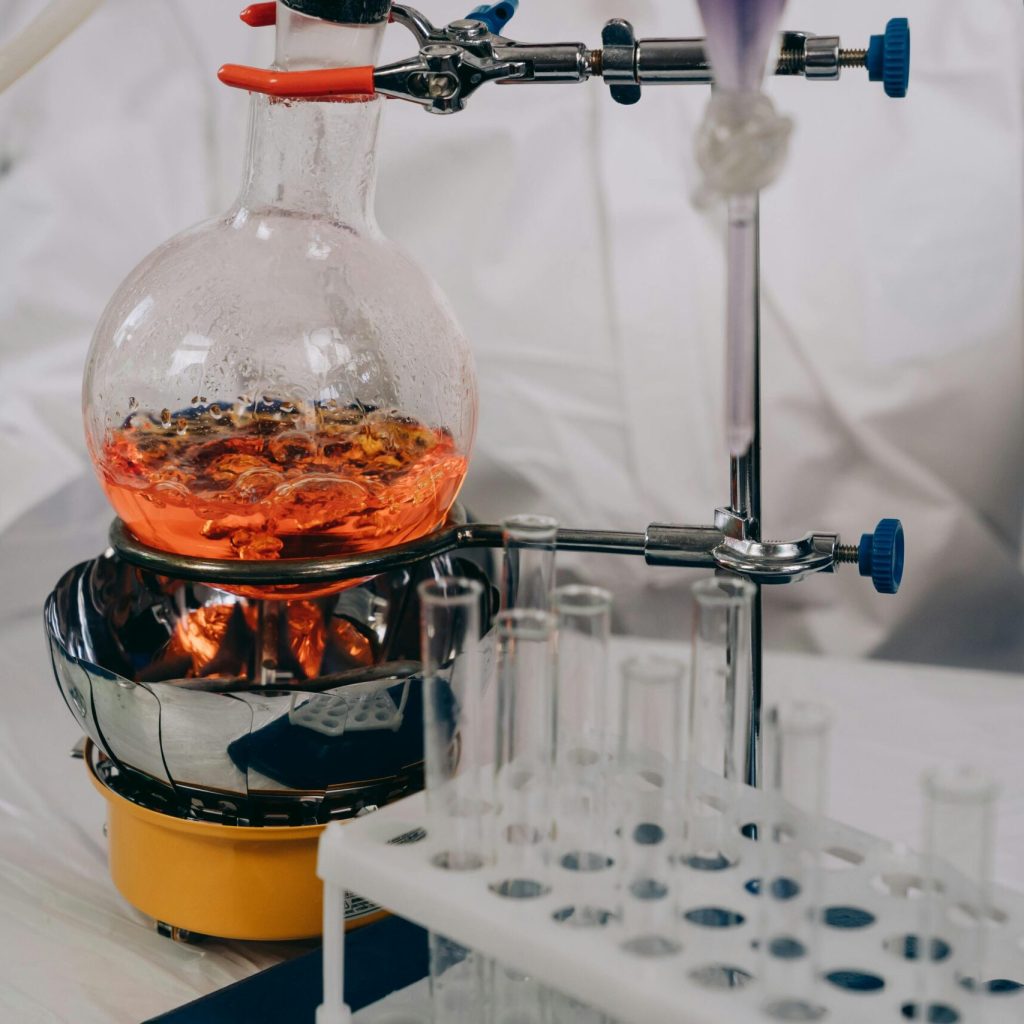 pexels photo 9243563 9243563 A close-up view of chemistry lab equipment with flasks and vials during an experiment.