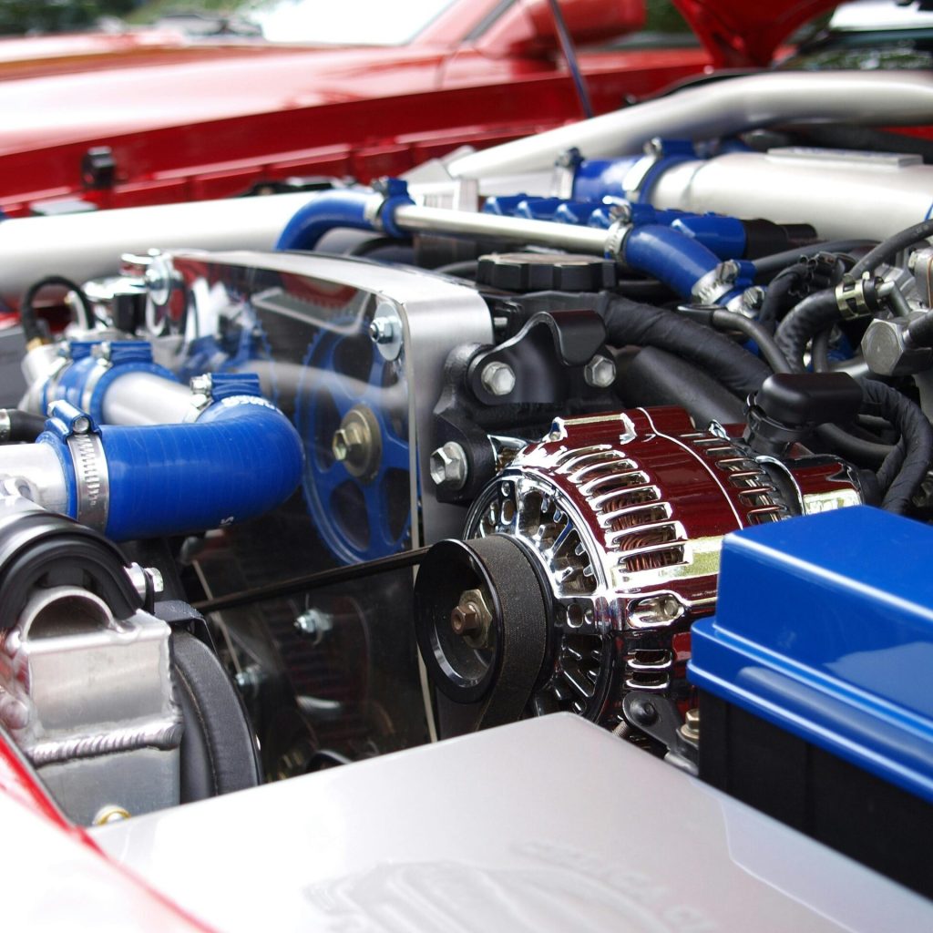 vehicle chrome technology automobile 65623 65623 Detailed view of a clean modern car engine with vibrant colored components and sleek design.